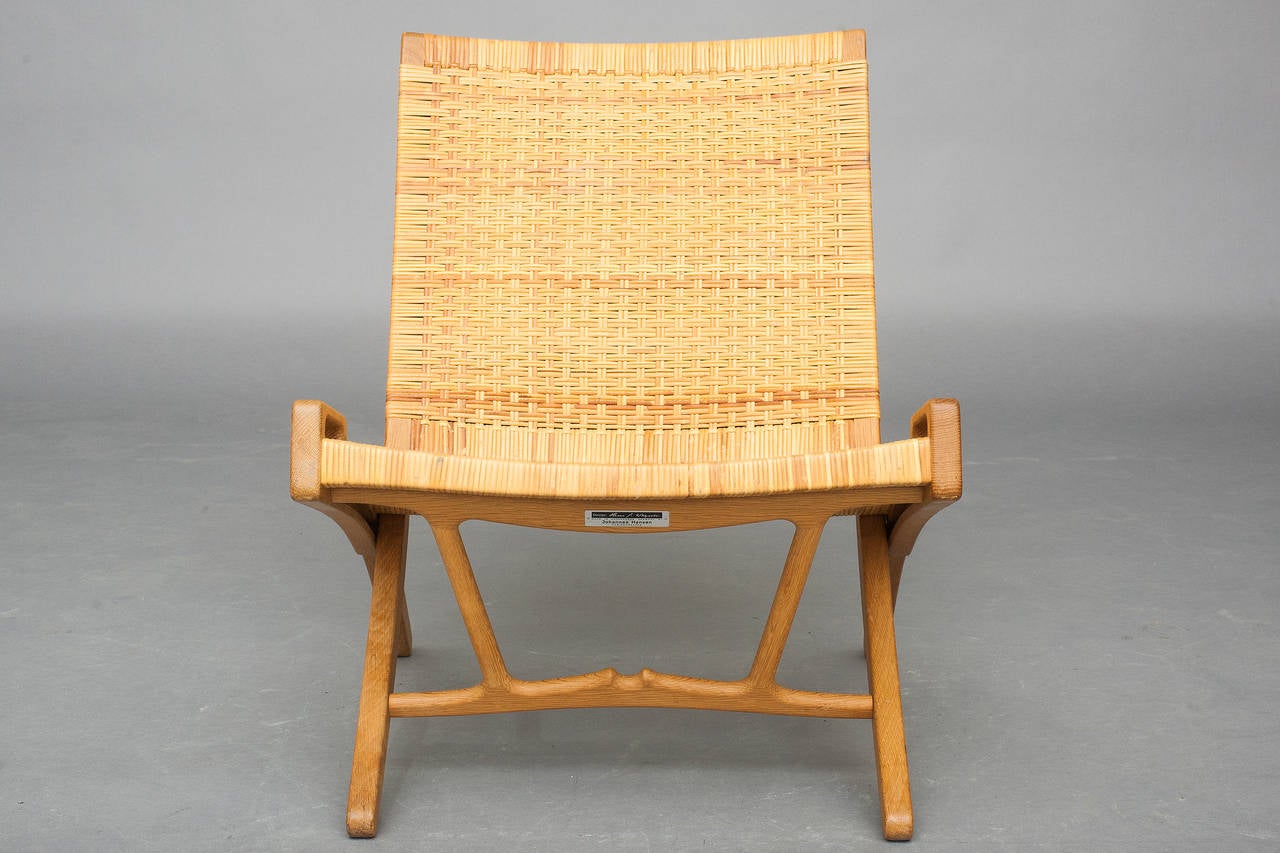 Folding chair in oak and cane.
Model: JH 512.