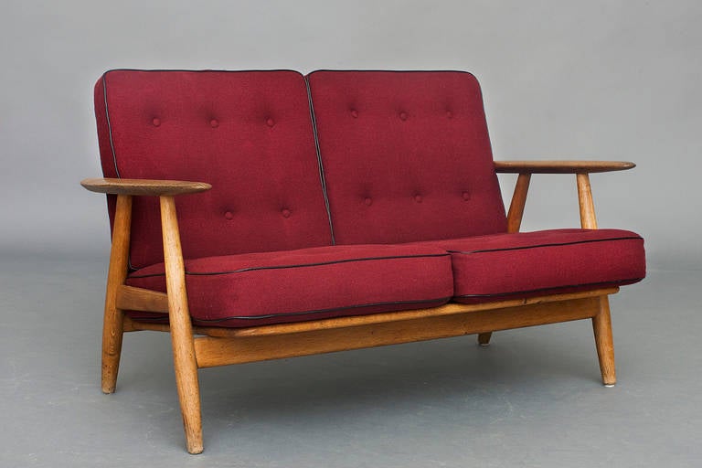 2-seater sofa by Hans J. Wegner for Getama. 
Model: GE 240 
Oak & cushions with wool upholstery. 
Nice vintage condition.