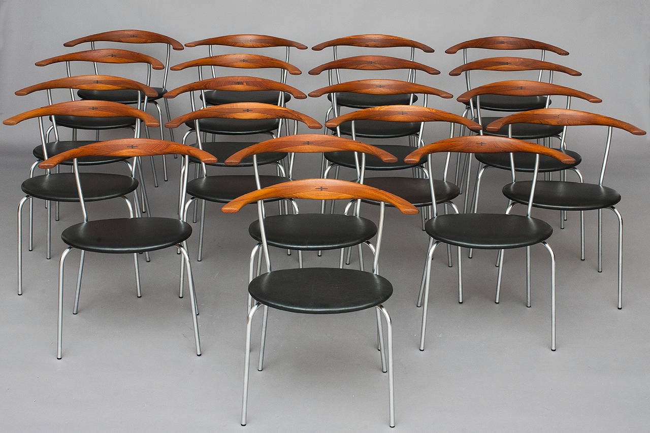16 armchairs by Hans J. Wegner for Johannes Hansen.
Model: JH701.
Design 1965.
Teak, chrome plated steel, black leather and inlaid wenge in backrest.
Nice original condition.