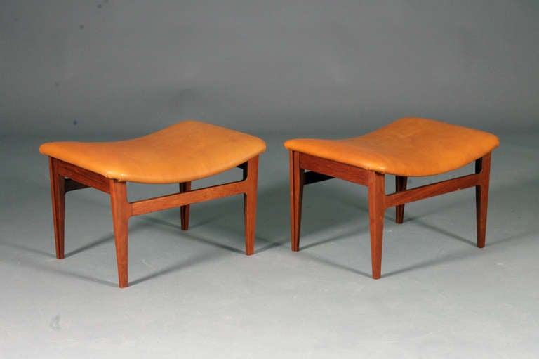Pair of Stools by Finn Juhl for France & Son.  Model: FD-140.  Teak & patinated leather.  Nice vintage condition.