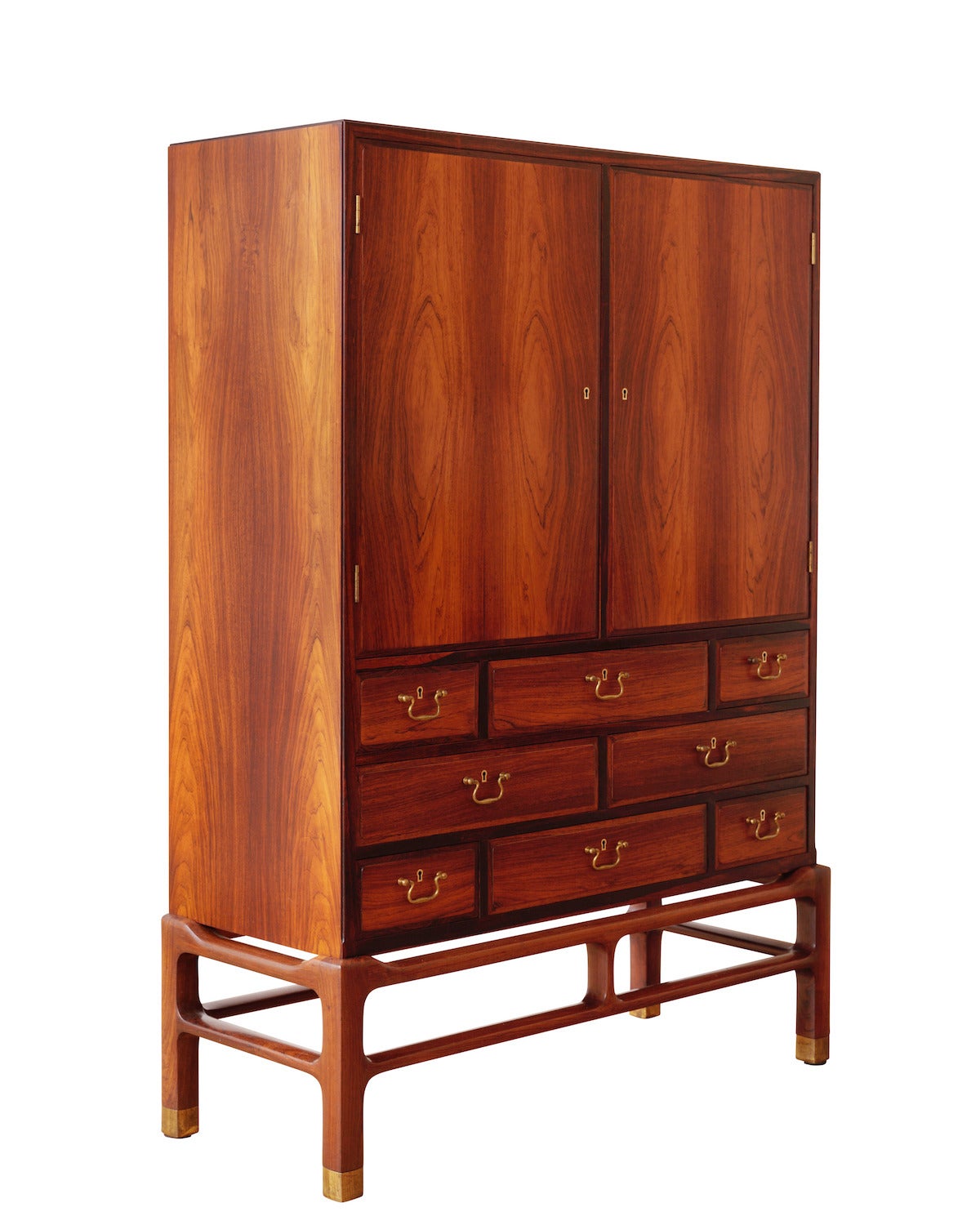 Cabinet with brass fittings, front with two cabinet doors and eight drawers.