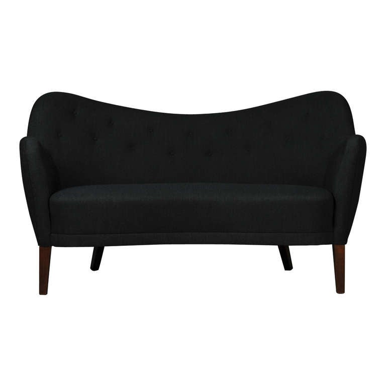 Two-seater sofa with new wool upholstery and varnished beech legs. Manufactured by Carl Brørup. Designed 1946
Literature: Similar sofa in furnitureindex/Designmuseum