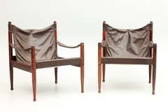 Pair of rosewood and leather safari chairs by Eilersen, Denmark.