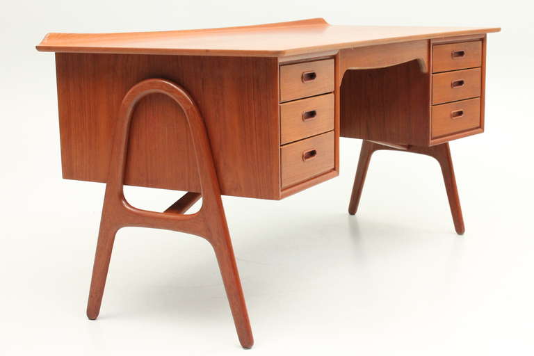 Desk with curved front and a lift. Designed in the late 1950s by Svend Aage Madsen and manufactured by H.P.Hansen Møbler, Danmark.