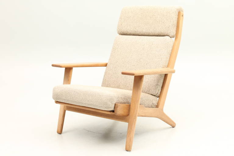 GE290 High back easy chair in oak with new fabric and original spring cushions. Designed by Hans Jørgensen Wegner and manufactured by Getama, Denmark.