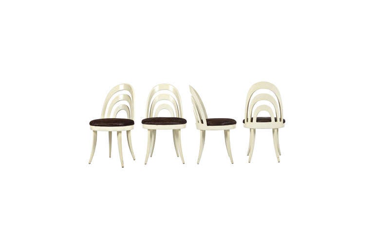 Set of (8) sculptural Harvey Probber Dining Chairs with elegant curved lines. Excellent condition structurally. Paint chipping and normal wear.