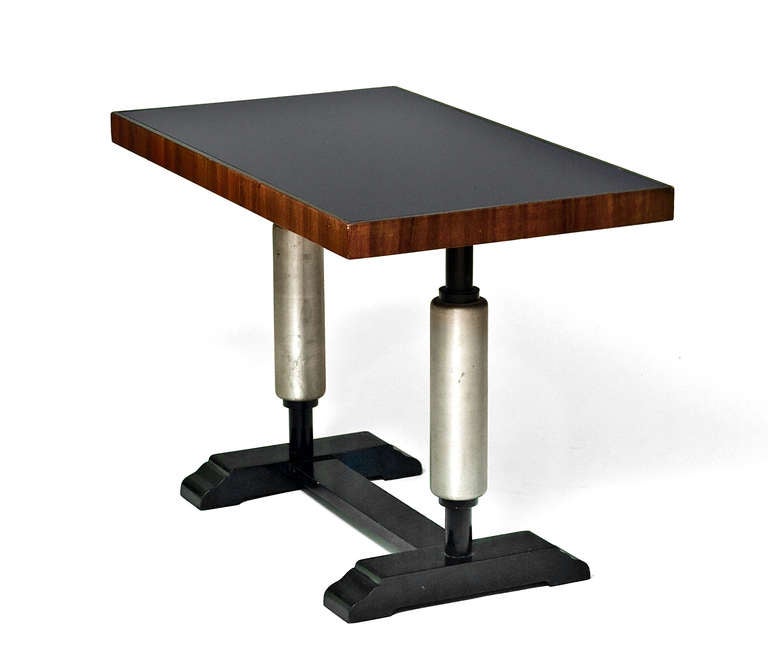 A fine pair of art deco side tables made in Nyköping, Sweden c:a 1930.
The tables has black glass tops, palisander freezes and black and metal painted legs.
As well as side tables they can be used as console tables.