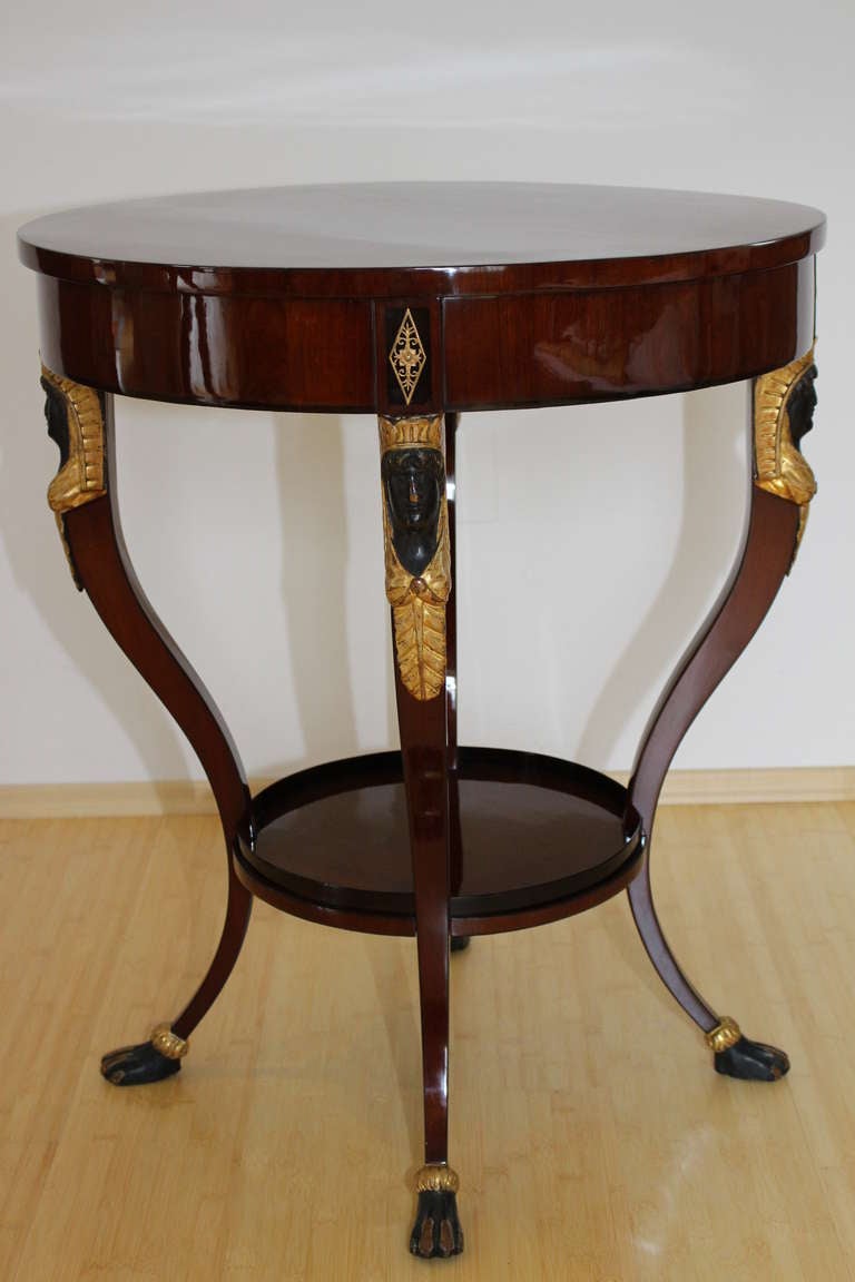 Viennese Empire Sidetable around 1810.
Mahogany on pine, pear massive, giltwood with Antico verde finsihings. Oromolou Mounts.
This type of furniture was standing in the salon and was a multitasking combination furniture. Part of the chest is a