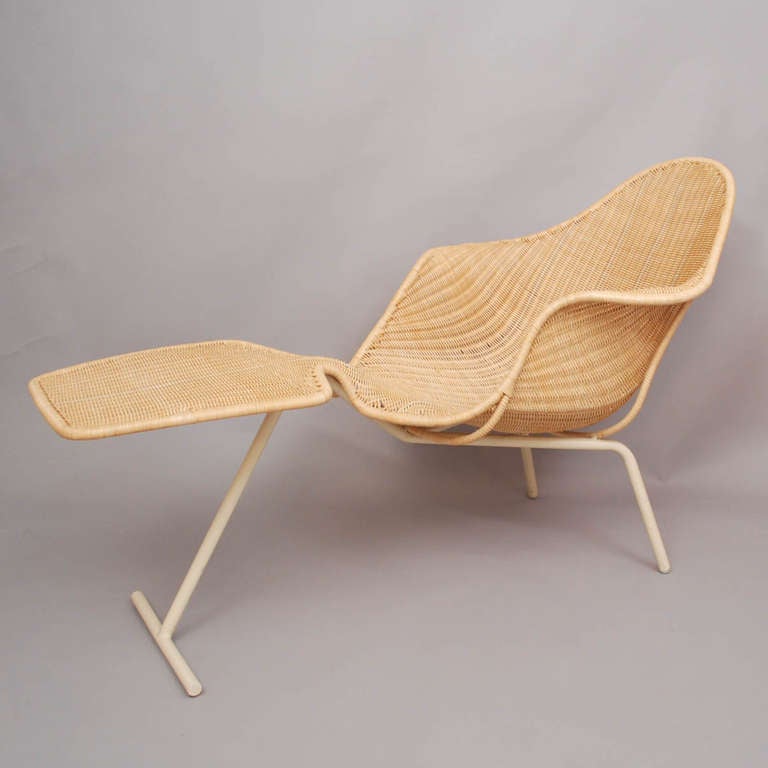 Apollo Recliner designed by Ross Lovegrove for Driade, Italy in 1997. 
Beige painted steel frame and plain rattan shell.