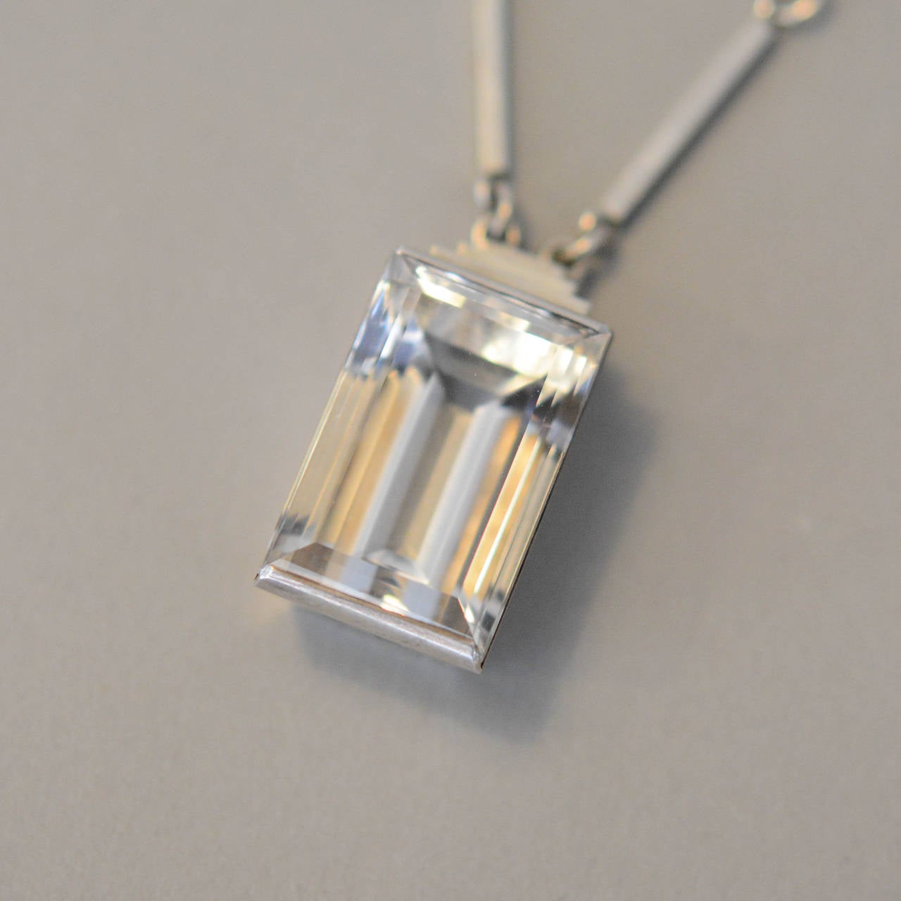 Sterling silver and rock crystal necklace by Wiwen Nilsson, Lund, Sweden. Signed and dated, V9, 1971.

Size pendant: 30 mm x 15 mm.
 L: 46 cm.