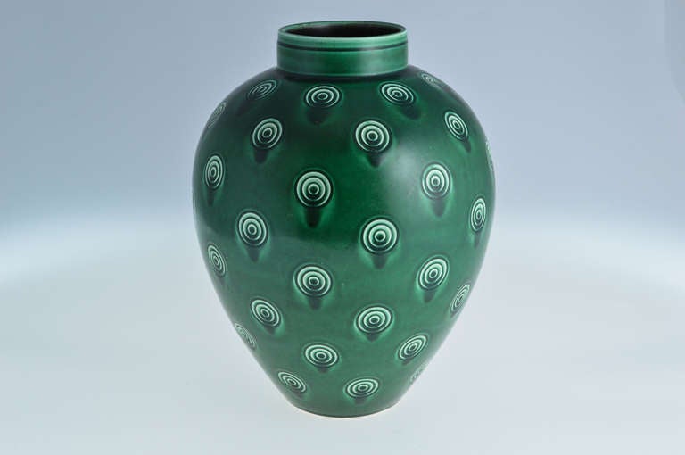 In 1933 Niels Thorsson was appointed Artistic Director at Aluminia, a branch of Royal Copenhagen. Flushing with vigor and creativity Thorsson designed and put several series in to production.

This striking large vase is from a pattern designed in