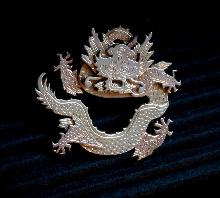 A Chinese Dragon brosch in two colored  gilded sterling silver. Sign Wiwen Nilsson STERLING SWEDEN AN L Y9=1973 43x50mm