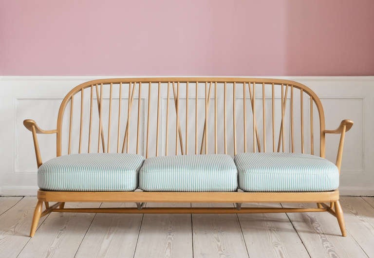 Ercol sofa bench in beech wood. Re-upholstered cushions.