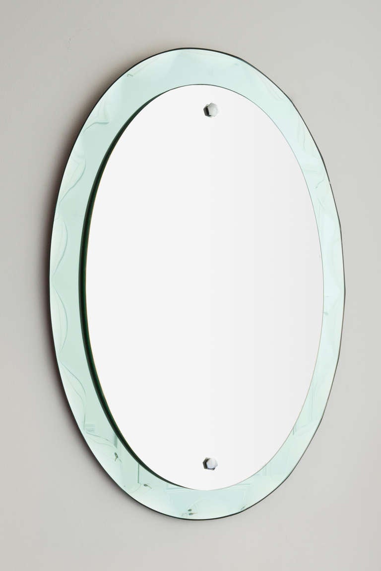 Italian 1960's mirror. Mirror on faceted aquamarine glass.