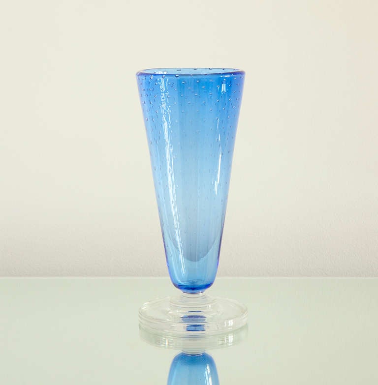 Beautiful glass vase by Swedish American Carl Erickson. Blue bubbled glass and clear glass base.