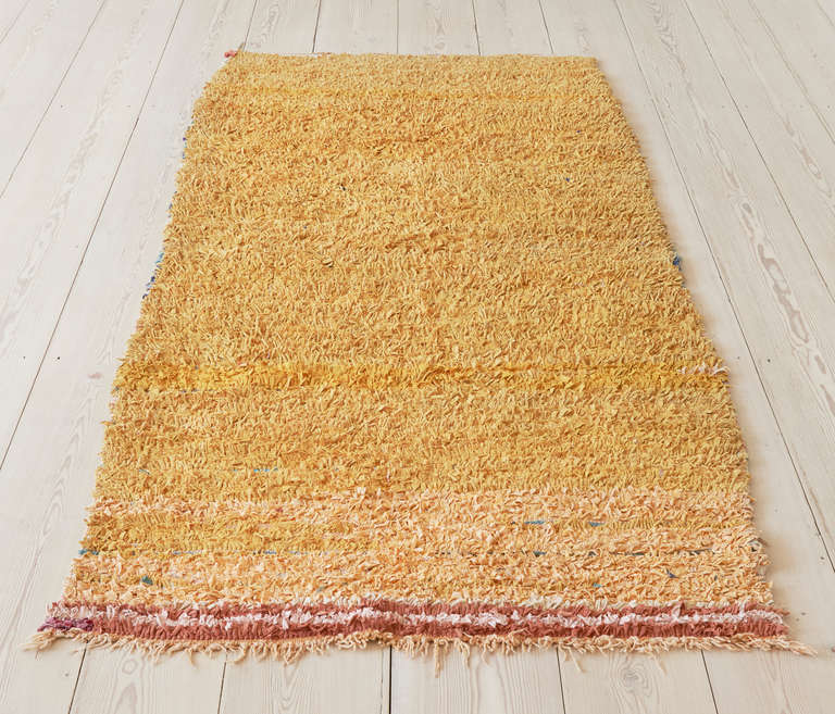 Moroccan Boucherouite rag rug in beautiful burnt yellow tones.