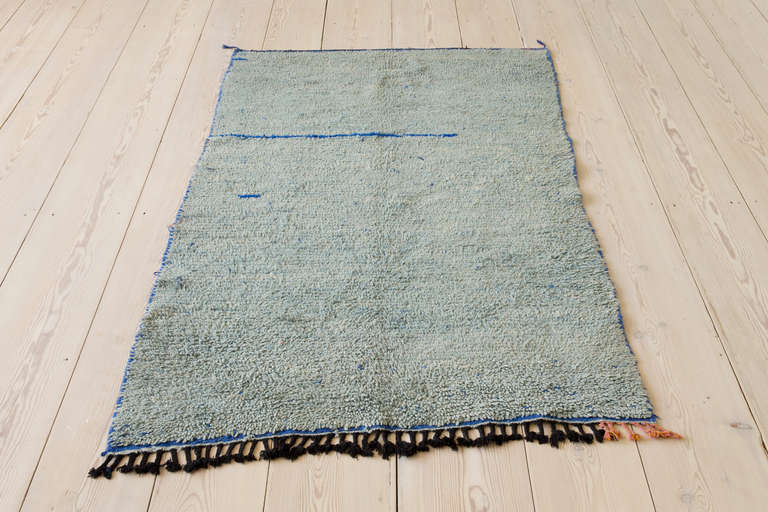 Middle Atlas rug in a beautiful teal blue with bright blue streaks.