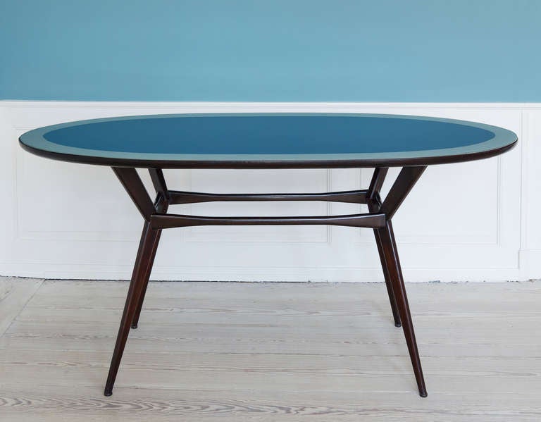 Stunning 1950's Italian console table. Glass table top in blue and light teal, base in stained wood.