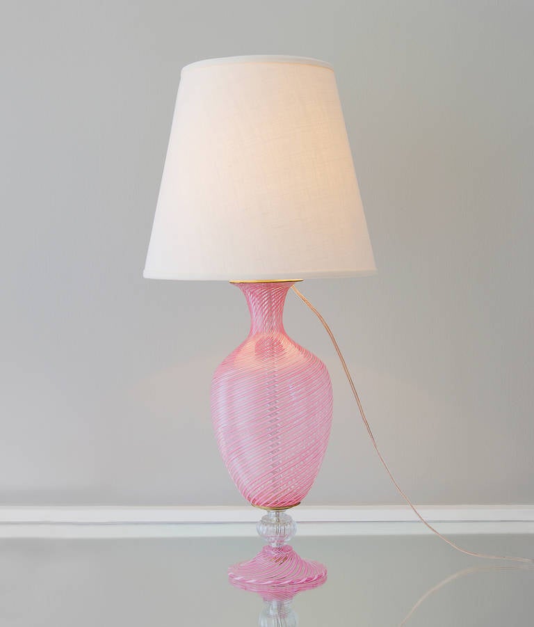 Beautiful Murano table lamp in clear glass with pink swirls.