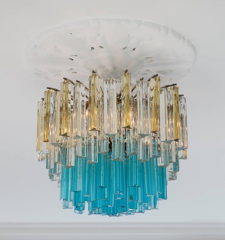 Rare 1960s Murano chandelier in clear, amber and turquoise glass rods.