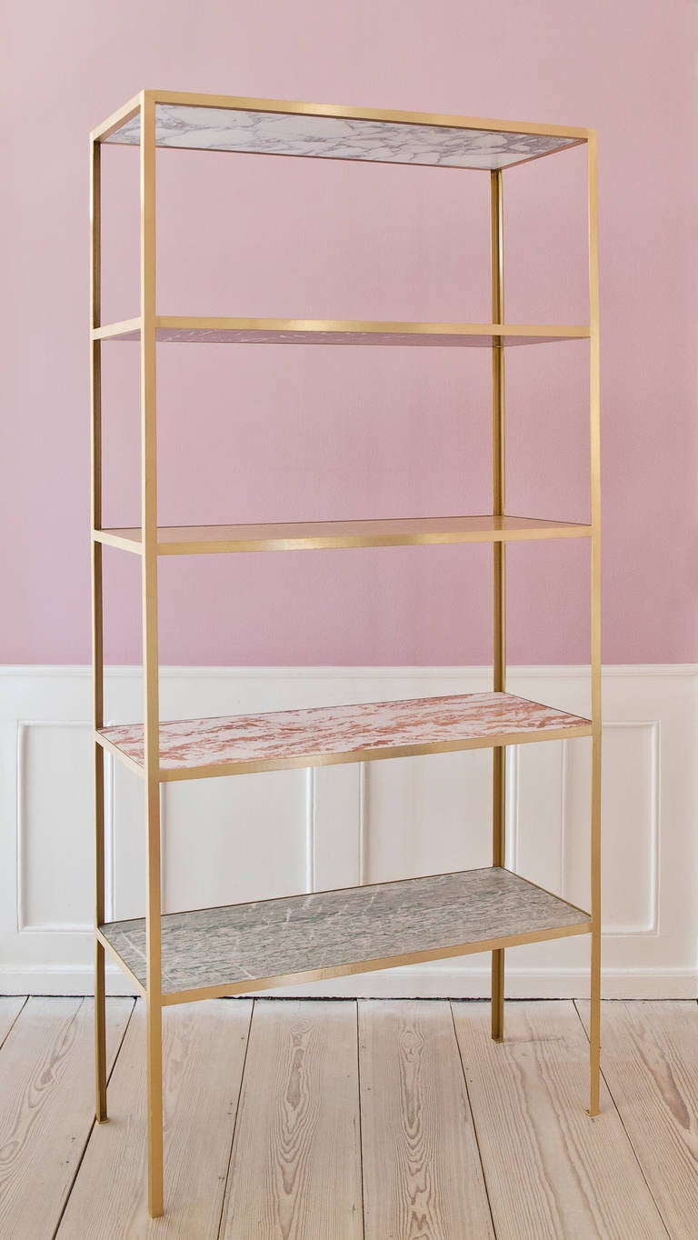 Marble bookshelf designed by Belgian designer duo Muller Van Severen. Unique design with shelves in varying marble sorts, brass frame.