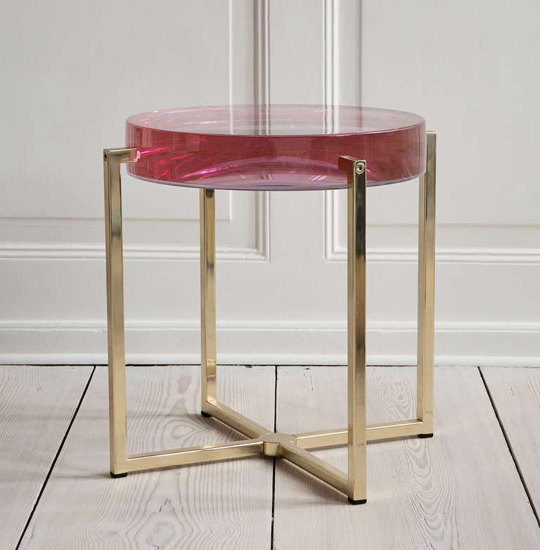 Tinted lens table with acrylic top and brass base.