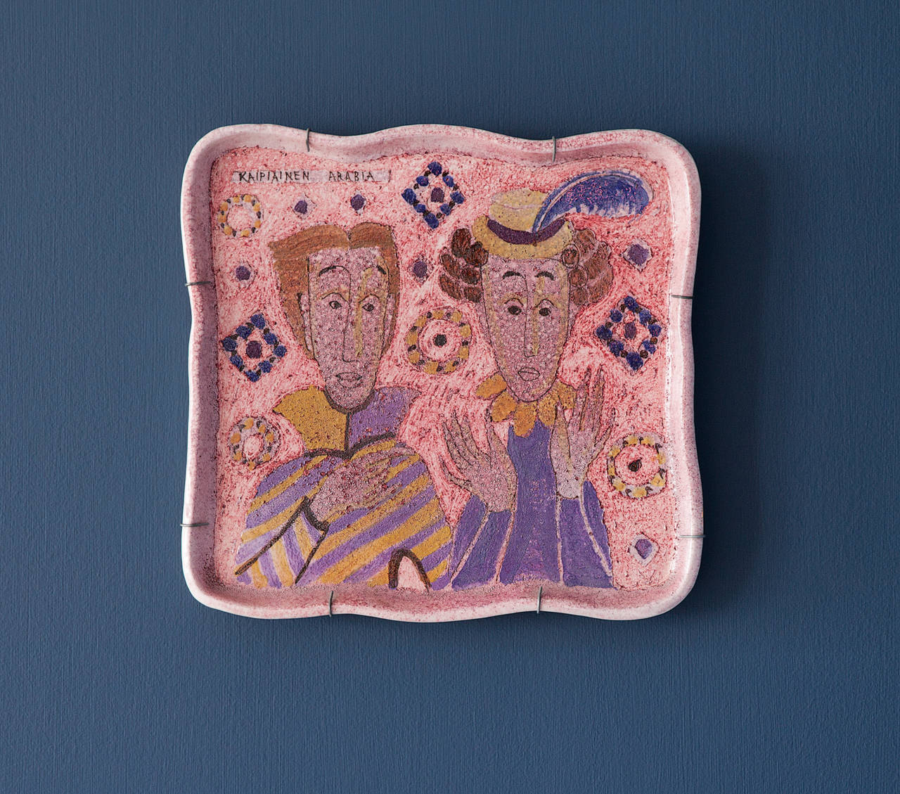 Unique glazed ceramic wall platter with decoration on pink fund by Birger Kaipiainen.