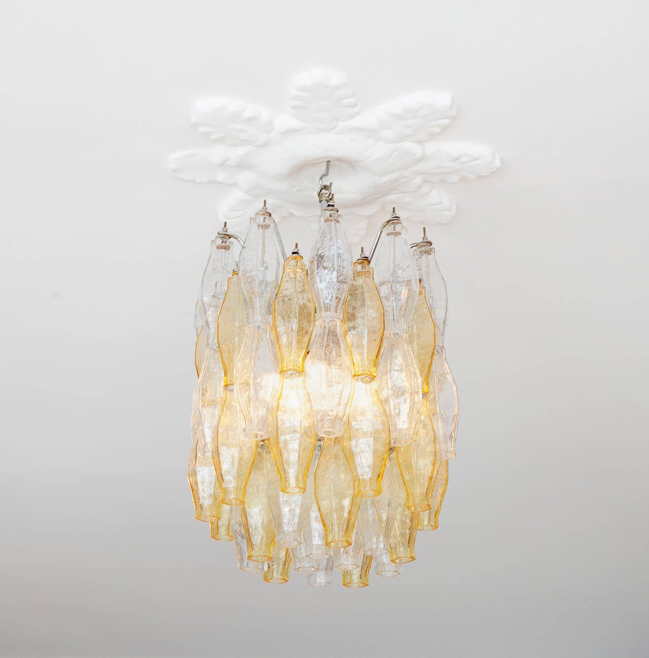 Beautiful Venini polythedral chandelier in clear and amber tinted glass.