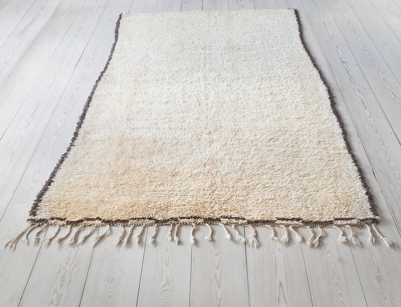 Exquisite Beni Ourain pile rug. Brown edges on ivory background, ivory tassels.