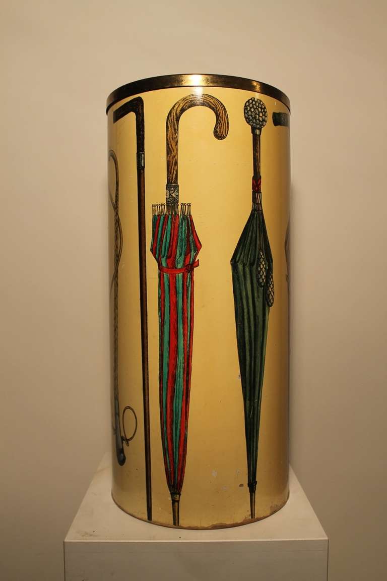 A very early and rare Piero Fronasetti umbrella stand in hand painted masonite.