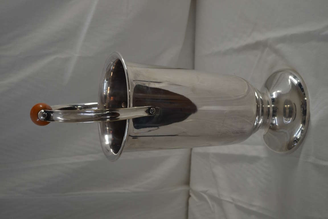 A silvered WMF champagne cooler for a magnum bottle