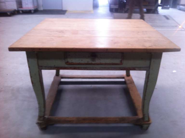 A very solid Austrian (pine) table, wood dowel pinned, painted in beautifull green , with a fruit-tree top, circa 1800.