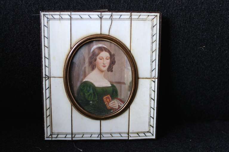 A Miniature Portrait of a Young Woman With A Bible In Her Hand, 19th Century,
