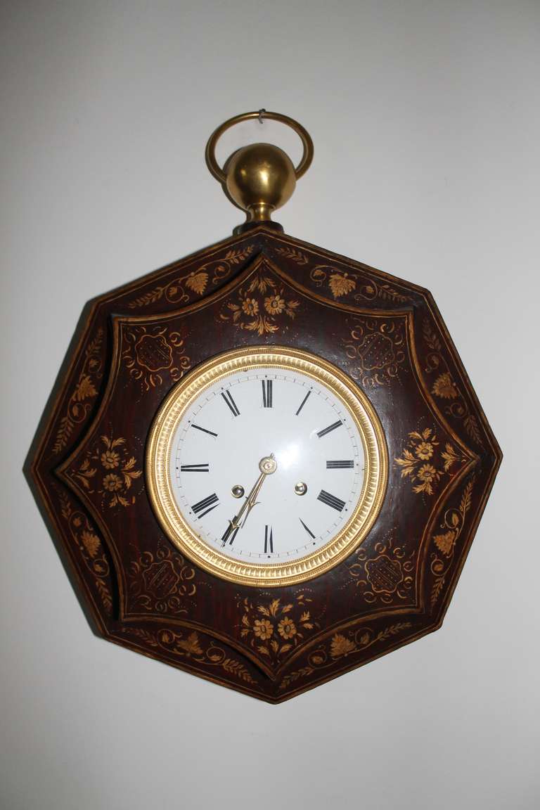 French 'Oeil de Boeuf' Clock in zinc with handpainted floral motives.
Porcelain dial, gilded bronze rings. Thread suspension, circa 1870