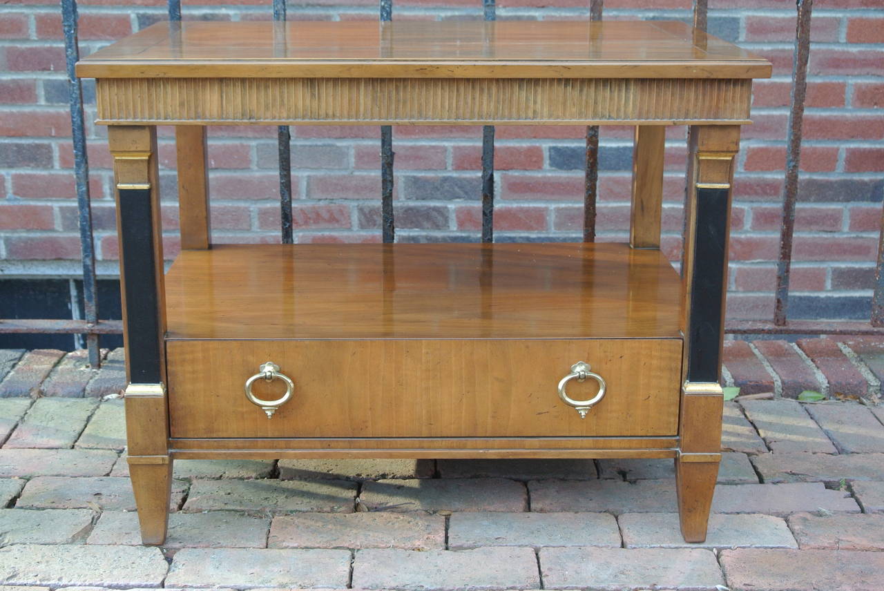 Walnut End Table by Baker. Painted Black columns w. Gilded Trim support a beveled drawer with two Italian brass pulls.