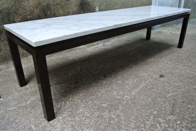 Beautiful Harvey Probber custom marble-top coffee table. Large Carrara marble atop a sculpted mahogany base.