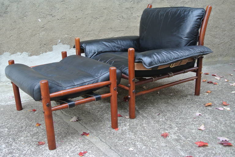 Beechwood Lounge chair & matching ottoman with Original Black Leather supported by leather straps & buckles.