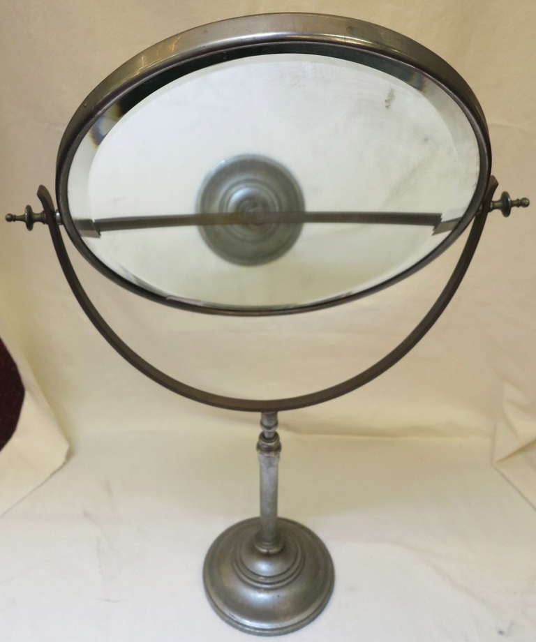 Rotating mirror and swivel double sided beveled. Foot ballasted lead
iron and nickel metal circa 1920 style Brot