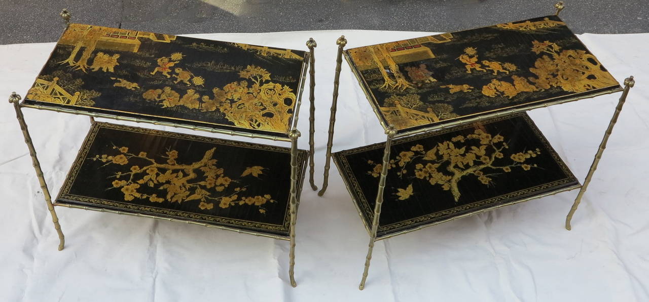 Pair of gilt bronze tables with amounts ending in the tray is decorated palm tree tops of a landscape in Chinese lacquer and other characters of a tree in bloom, the plates are screwed circa 1970 good condition.