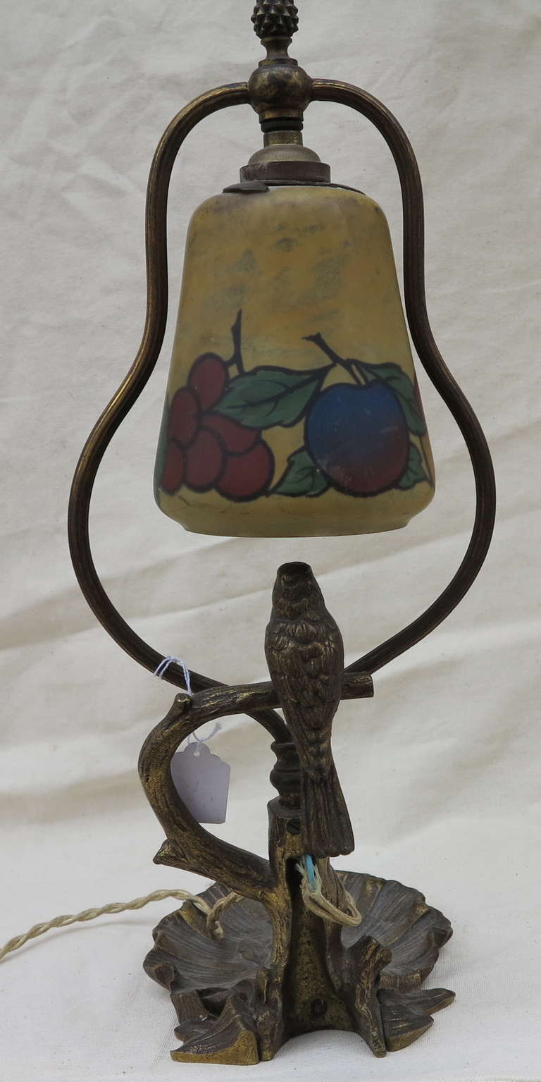 Bronze lamp with shade glass paste painted or enameled inside, then from 1920 to 1925, in good condition