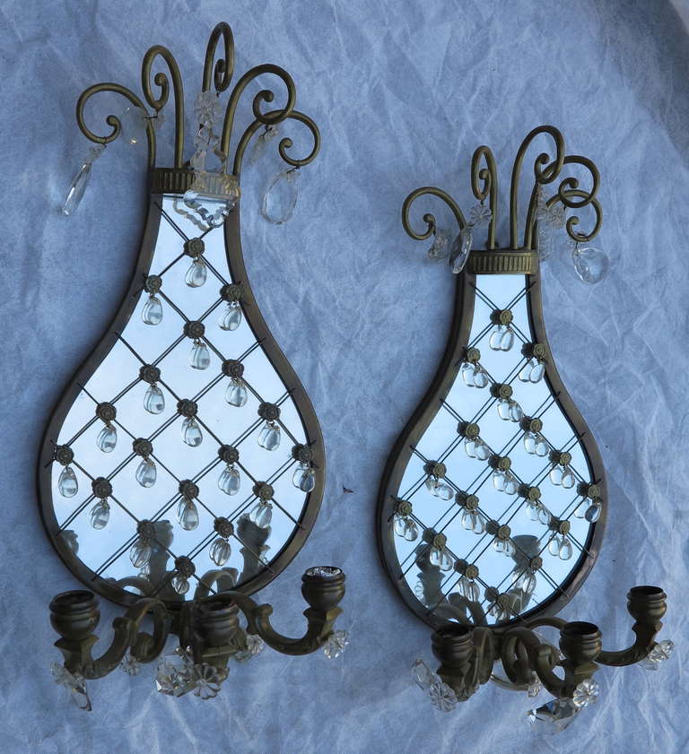 Pair of bronze sconces with mirrored background, mesh and glass drops, three arm light, good condition, circa 1920-1940