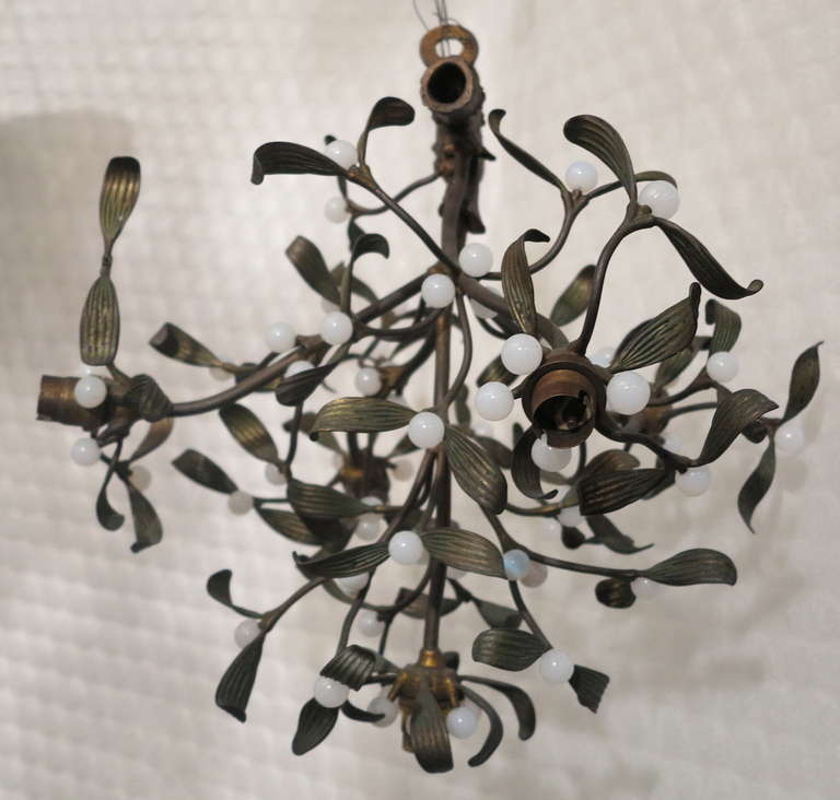 Bronze mistletoe chandelier with opaline beads.
