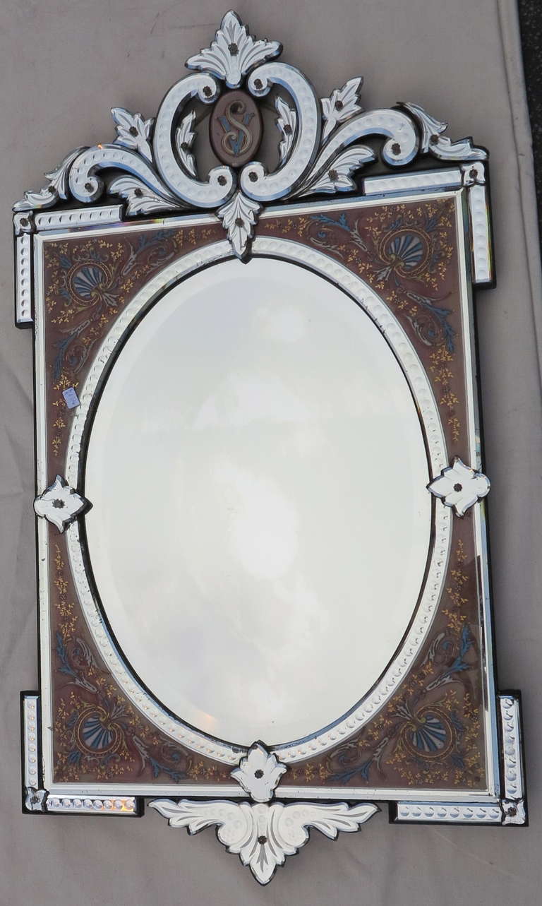 Oval mirror beveled with a frame of colored glass raised by enamelled decorations
Good condition, circa 1880/1900