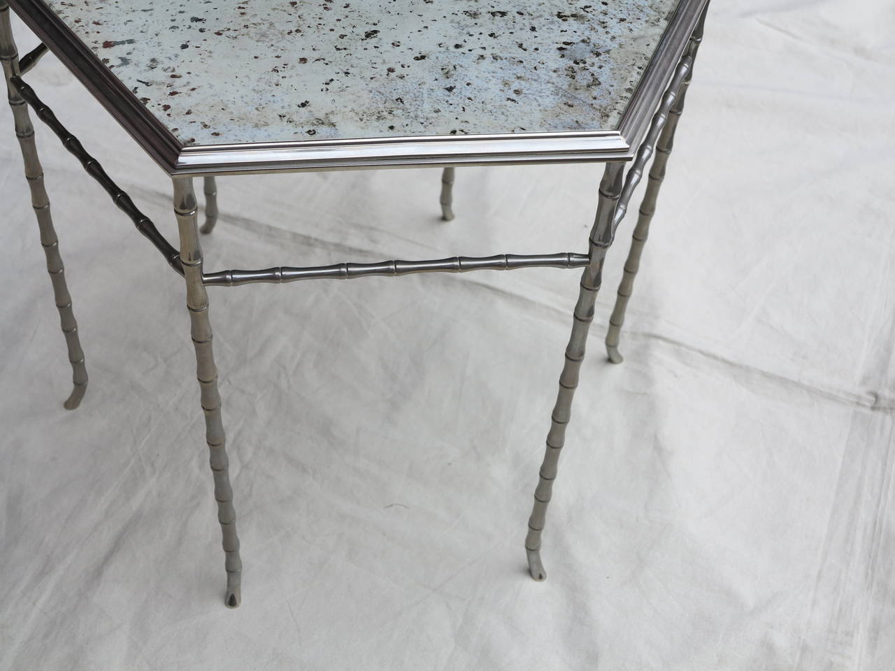Pair of Pedestal table or table of silvered bronze model bamboo in the style of Maison Baguès, top oxidized and silvered mirror, everything is screwed, good condition,some traces of using with age 62 cm is the diagonal, circa 1950-1970.
