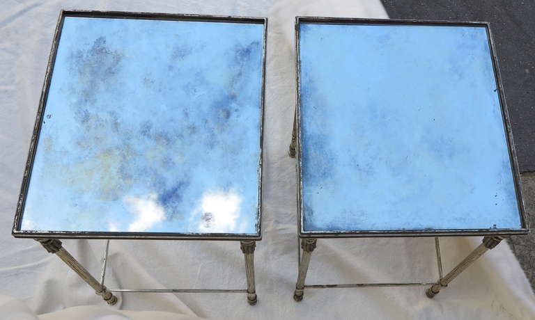 Pair of silvery or nickel-plated bronze tables with decoration on the amounts of ponpons, everything is screw ,tops in silvery mirror aged and oxidized, good condition, circa on 1950