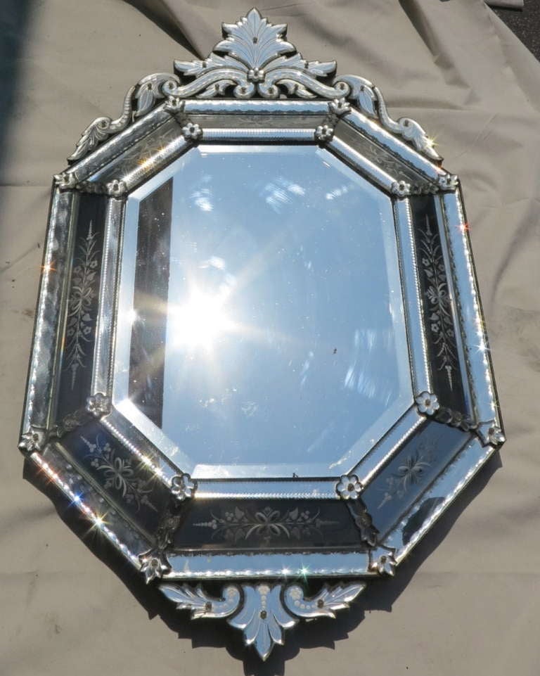 Large octagonal Venetian style mirror, with engraved decorations.  Parquet on back.