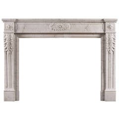 A French Louis XVI style antique fireplace mantle