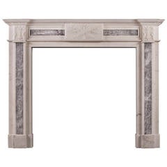 A Statuary marble antique fireplace mantel with grey marble inlay