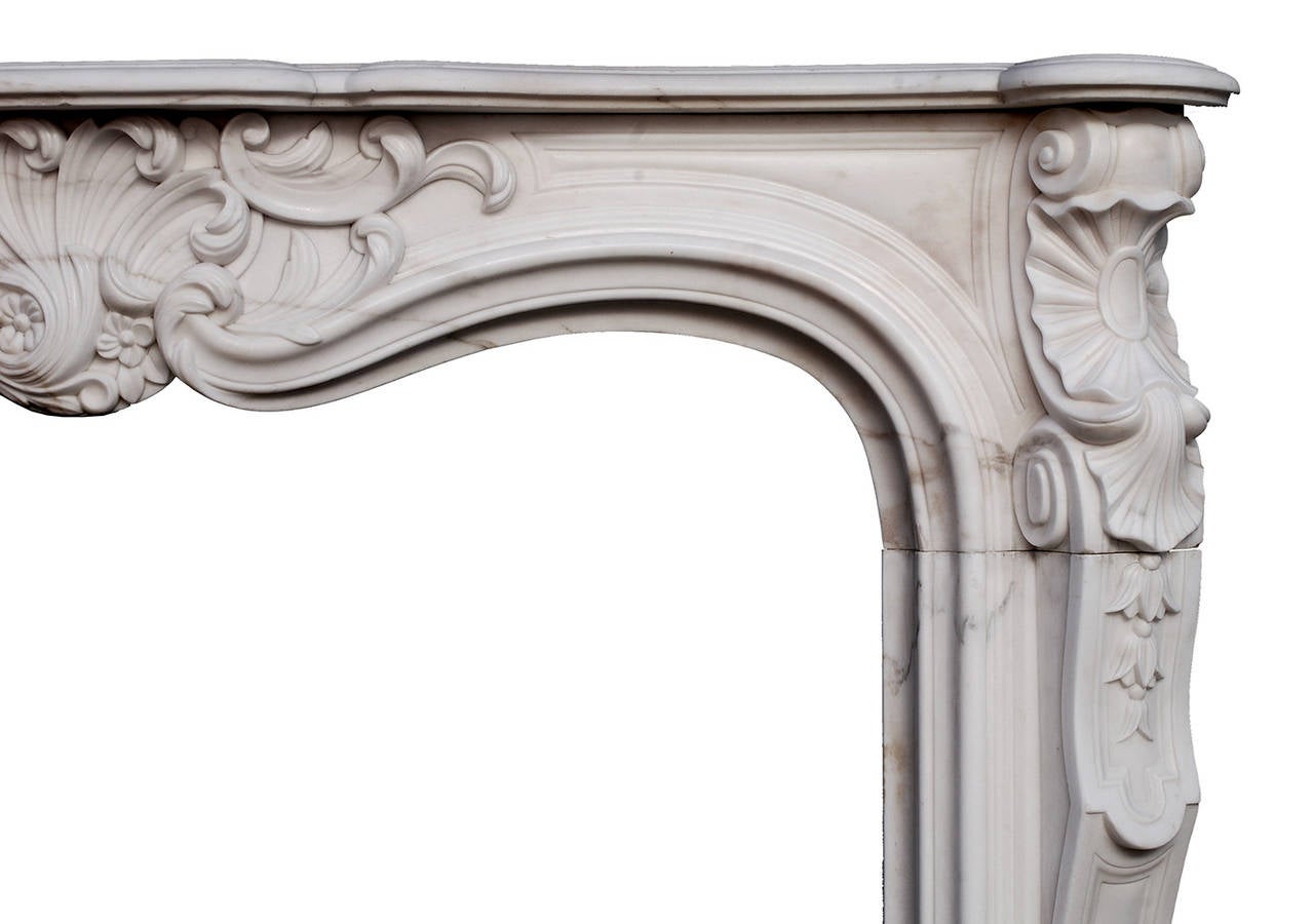 A 19th Century French Louis XV style marble Fireplace Mantle