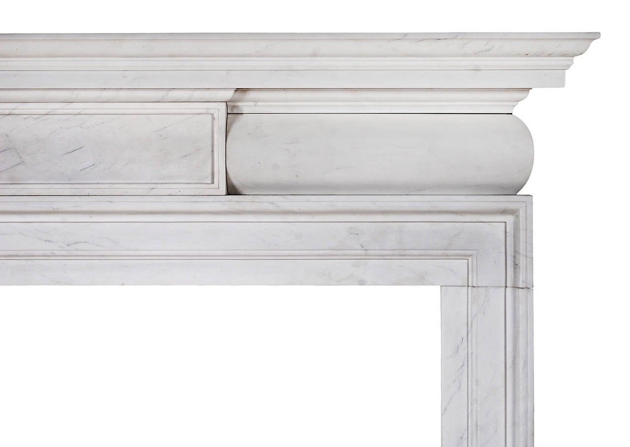 A refined and well proportioned mid Georgian style fireplace in white marble. The barrel frieze with panelled centre, and elegant moulded jambs and shelf. A copy of an 18th century design.

Shelf Width:	1549 mm      	61 in
Overall Height:	1391 mm   